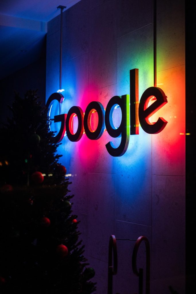 Photo by Sascha Bosshard the google logo is lit up at night